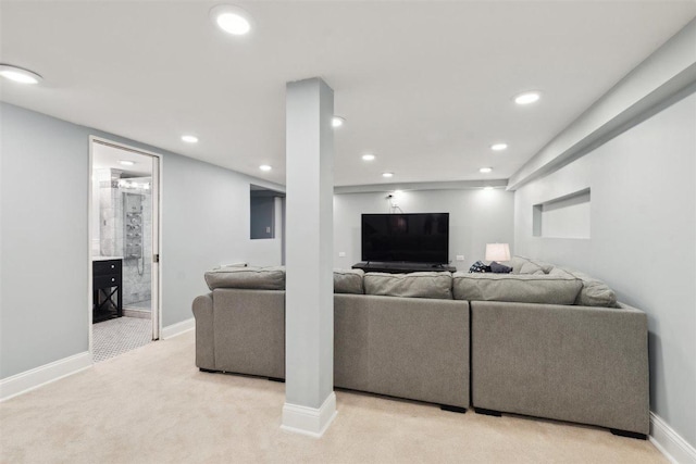 living room featuring baseboards, light colored carpet, and recessed lighting