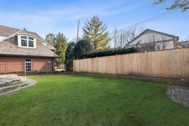 view of yard featuring fence