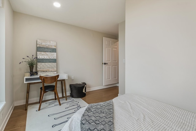 bedroom with recessed lighting, baseboards, and wood finished floors