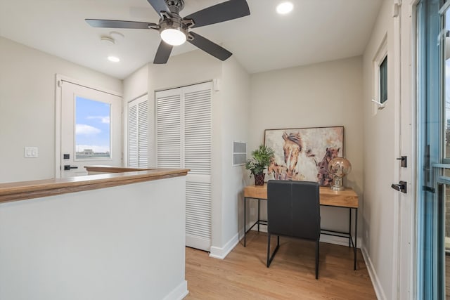 office space with recessed lighting, baseboards, ceiling fan, and light wood finished floors