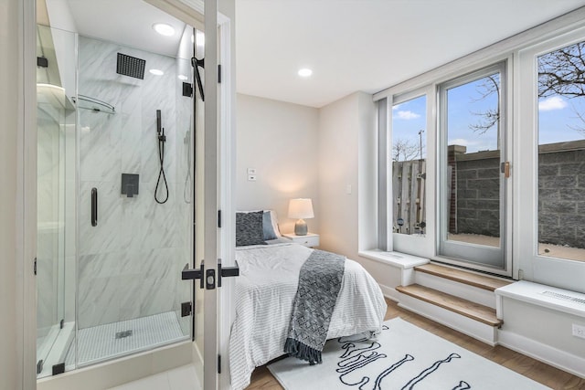 bedroom with wood finished floors and recessed lighting