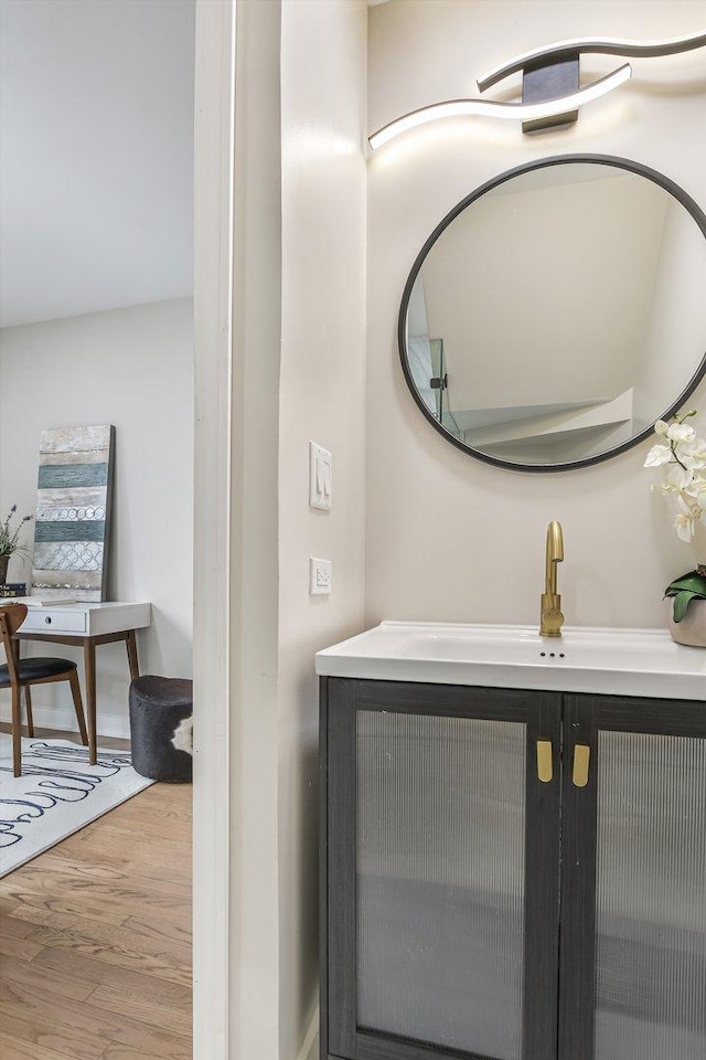 bathroom featuring a sink and wood finished floors