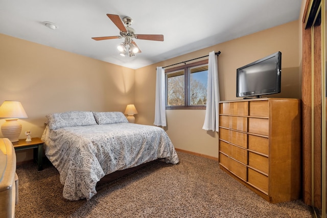 carpeted bedroom featuring ceiling fan and baseboards