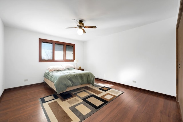 bedroom with dark wood-type flooring, baseboards, and ceiling fan