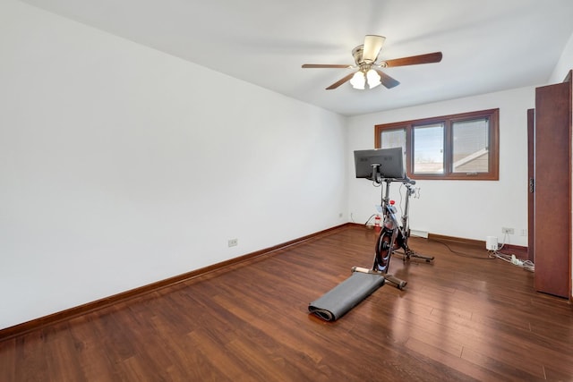 workout area featuring wood finished floors, baseboards, and ceiling fan