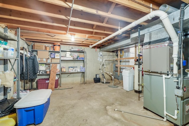 unfinished basement featuring heating unit