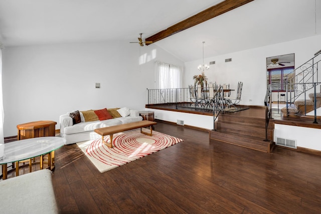 living room featuring visible vents, vaulted ceiling with beams, stairway, ceiling fan with notable chandelier, and wood-type flooring