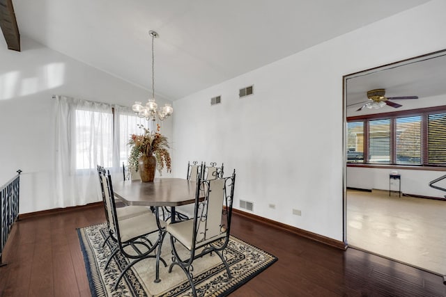 dining space featuring visible vents, lofted ceiling, hardwood / wood-style floors, and ceiling fan with notable chandelier