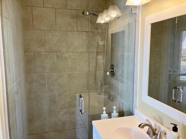 bathroom featuring a stall shower and vanity