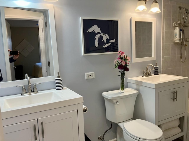 bathroom with toilet and vanity