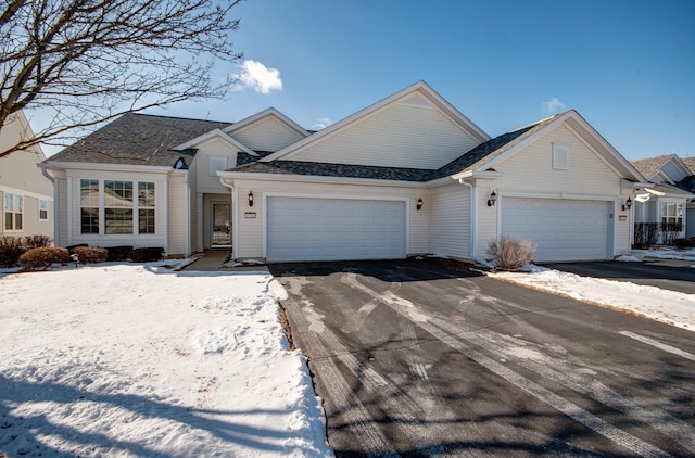 view of front of home featuring an attached garage and driveway