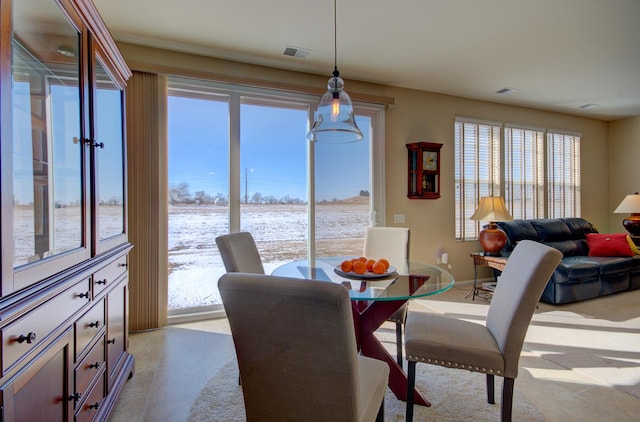 dining room with baseboards and visible vents