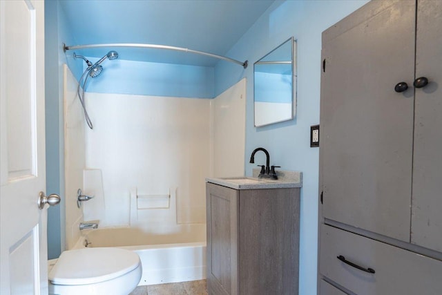 bathroom with toilet, shower / bathing tub combination, and vanity