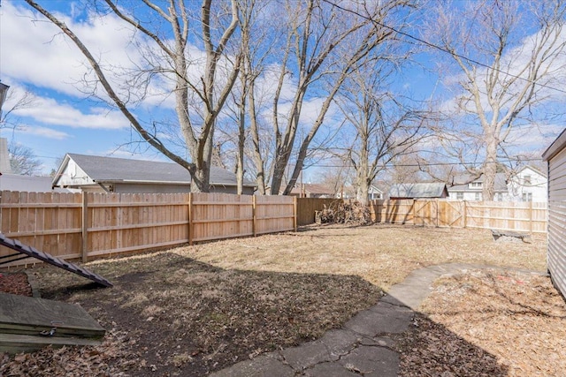 view of yard with a fenced backyard