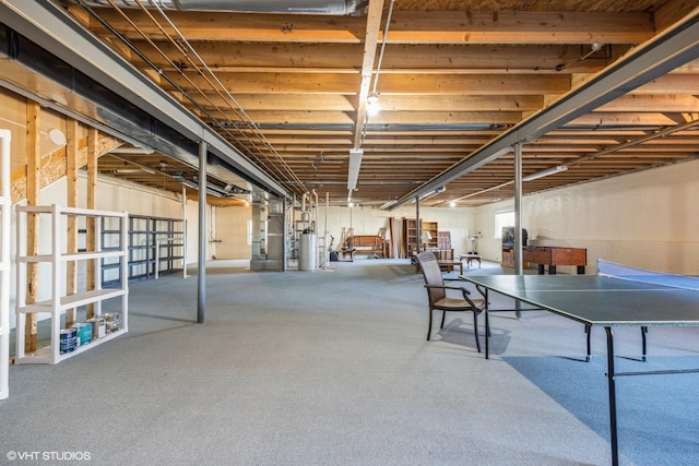 basement featuring gas water heater and heating unit