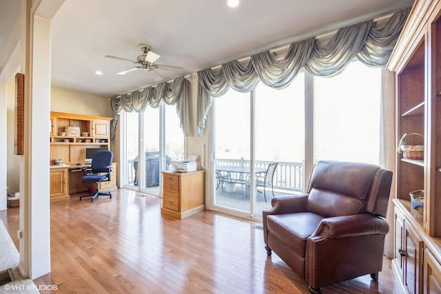 living area featuring light wood-style floors, recessed lighting, and ceiling fan