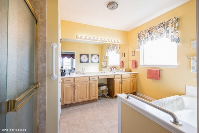 full bath with double vanity, tile patterned floors, plenty of natural light, and a shower stall