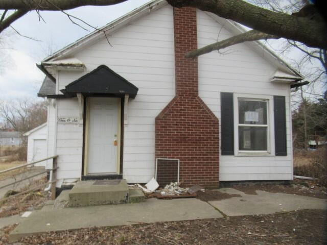 view of front of property with a chimney