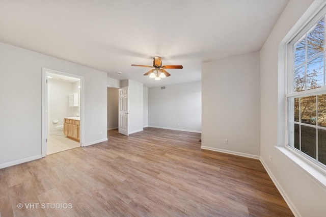 unfurnished bedroom with a ceiling fan, baseboards, and light wood finished floors