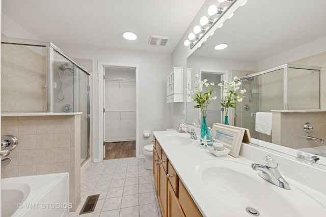 bathroom featuring a sink, visible vents, and a shower stall