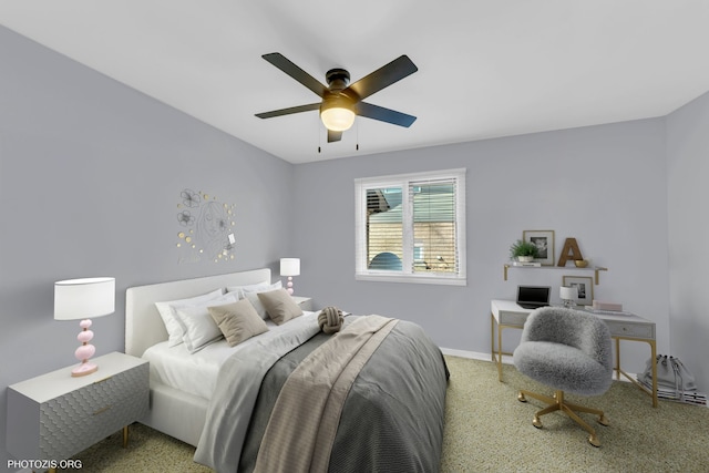 carpeted bedroom featuring ceiling fan and baseboards