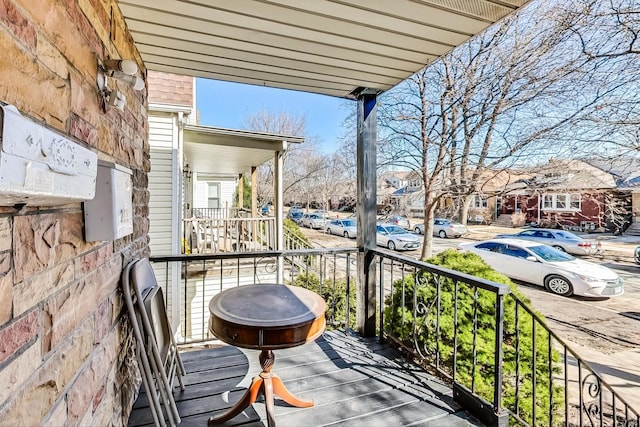 balcony featuring a residential view and a porch