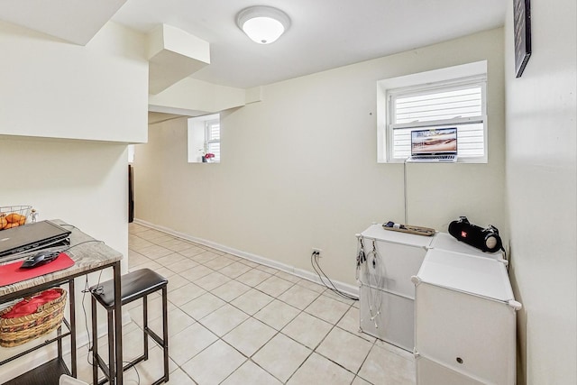 kitchen with light tile patterned floors and baseboards