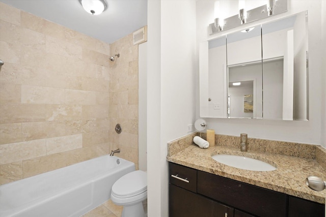 bathroom with toilet, shower / tub combination, vanity, and tile patterned floors