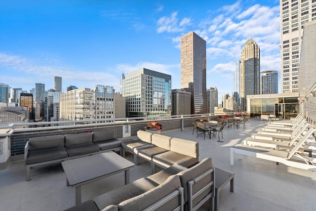 view of patio / terrace with outdoor lounge area and a city view