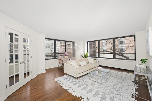 living area featuring french doors and wood finished floors