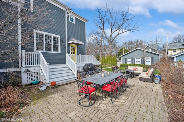 view of patio / terrace featuring outdoor dining area, an outdoor living space, and area for grilling