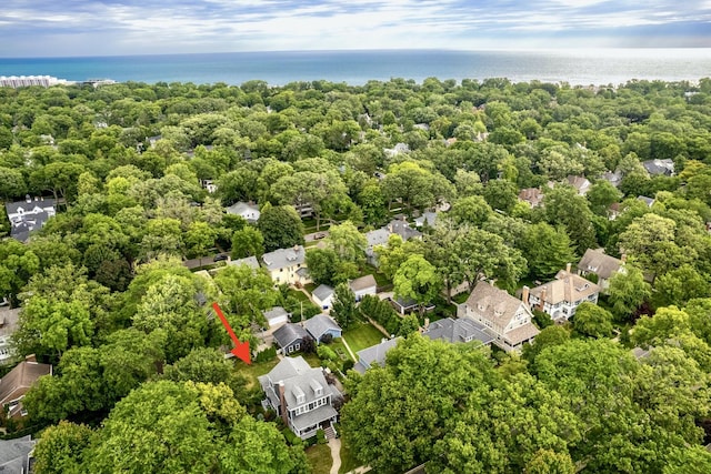 drone / aerial view featuring a residential view and a water view