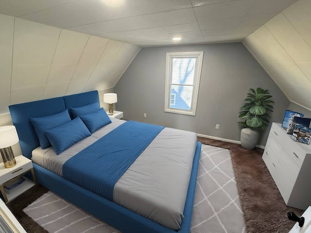 bedroom featuring carpet floors, vaulted ceiling, and baseboards