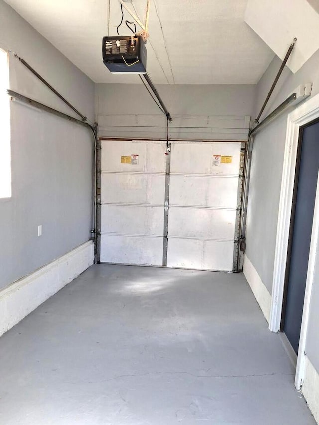 garage featuring a garage door opener