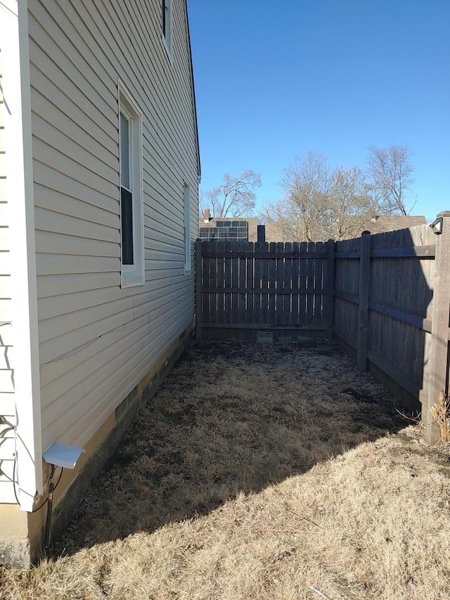 view of yard with a fenced backyard