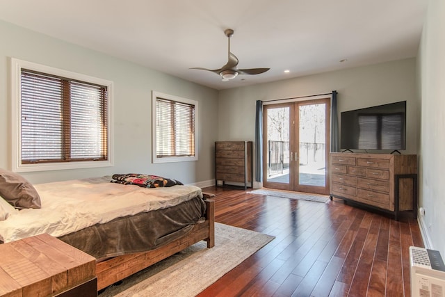 bedroom with french doors, multiple windows, dark wood finished floors, and access to exterior