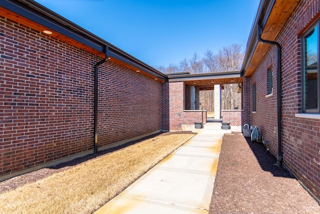 view of side of property with brick siding