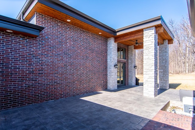 view of patio featuring a ceiling fan