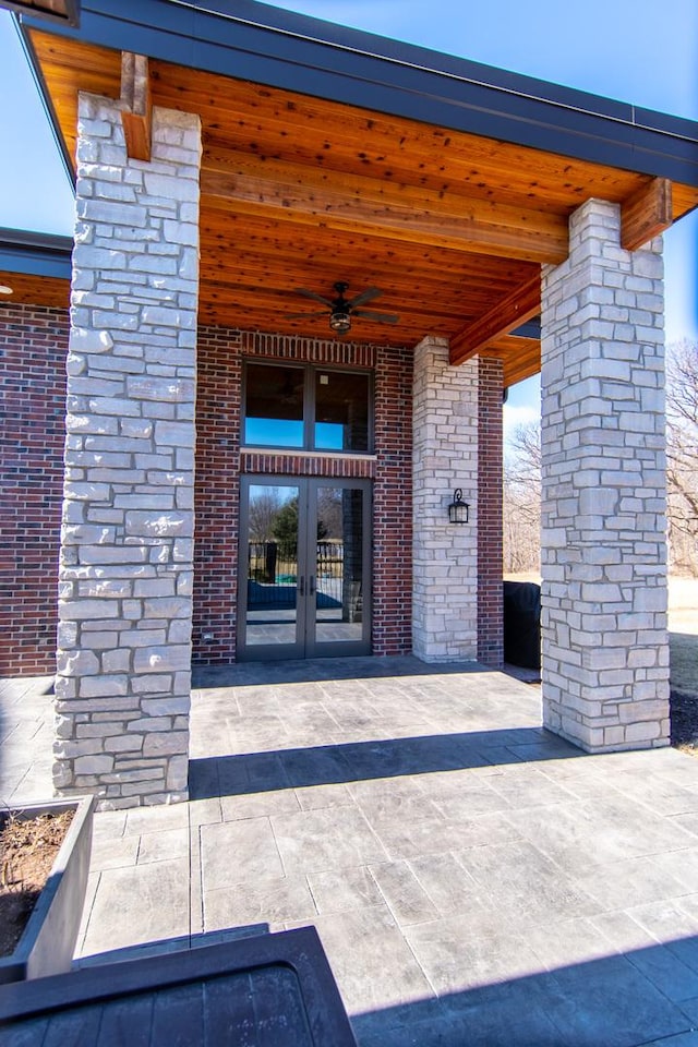 property entrance with french doors and ceiling fan