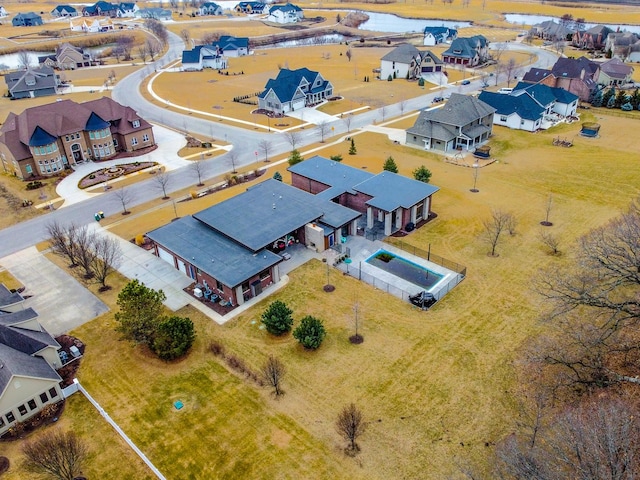 bird's eye view featuring a residential view and a water view