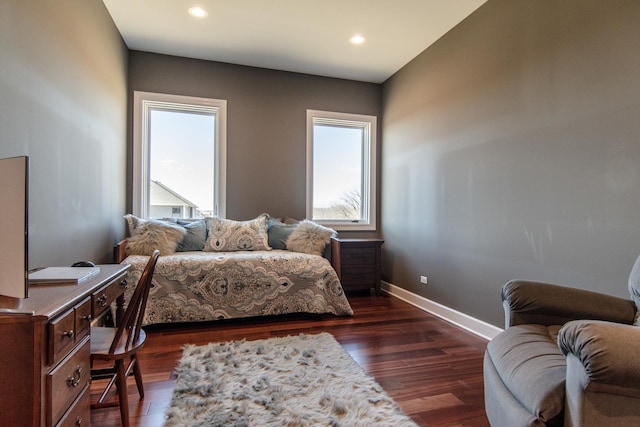 bedroom with recessed lighting, baseboards, multiple windows, and dark wood-type flooring