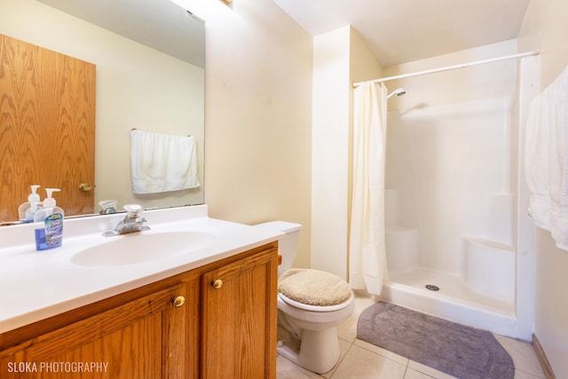 full bath featuring toilet, a stall shower, tile patterned flooring, and vanity