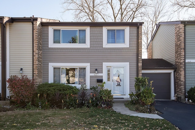 view of front of home featuring driveway and an attached garage