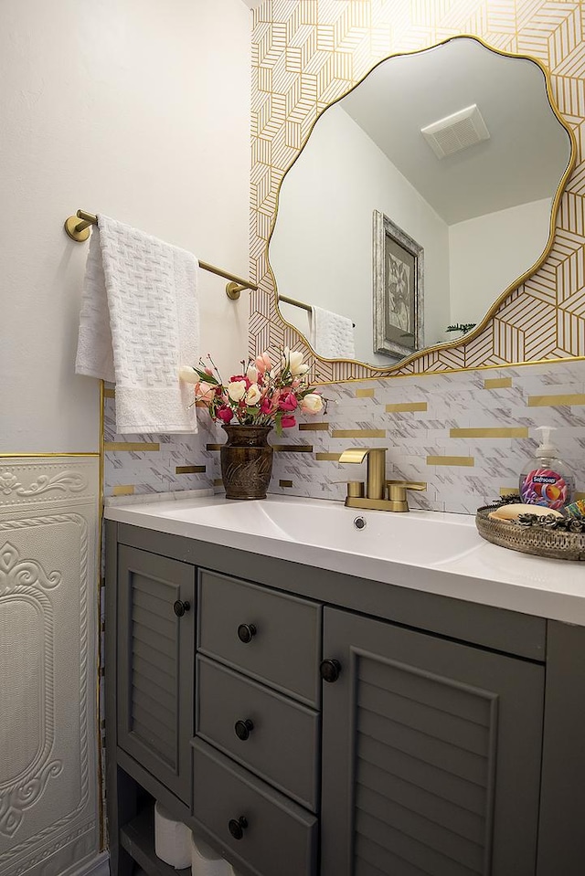 bathroom with wainscoting and vanity