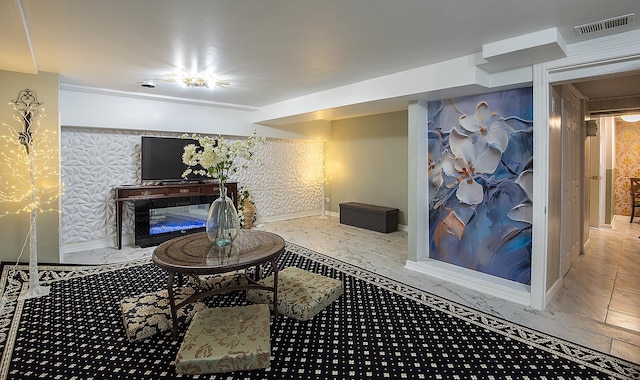 living room with marble finish floor, baseboards, and visible vents