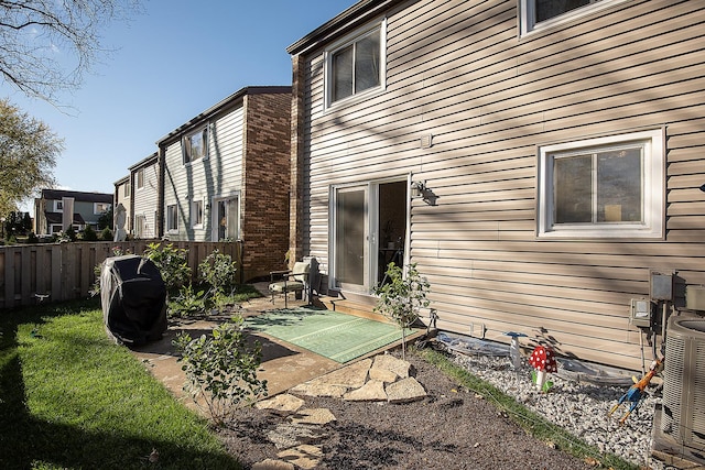 exterior space featuring fence and central air condition unit