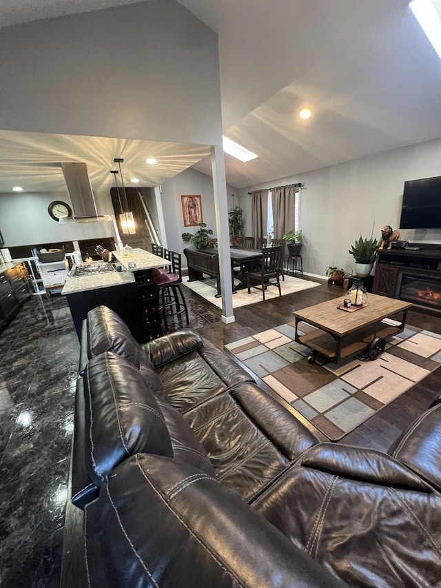 living area featuring lofted ceiling and recessed lighting