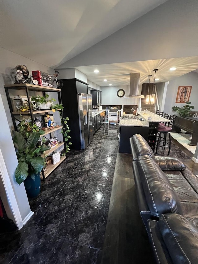 interior space featuring lofted ceiling, marble finish floor, and recessed lighting