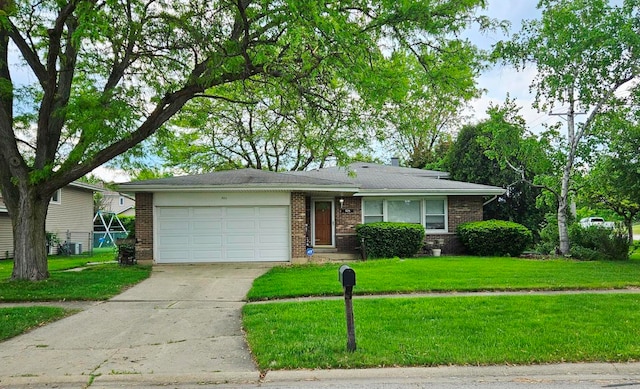 926 E Balsam Ln, Bartlett, IL 60103 - ranch-style home featuring an attached garage, driveway, brick siding, and a front yard