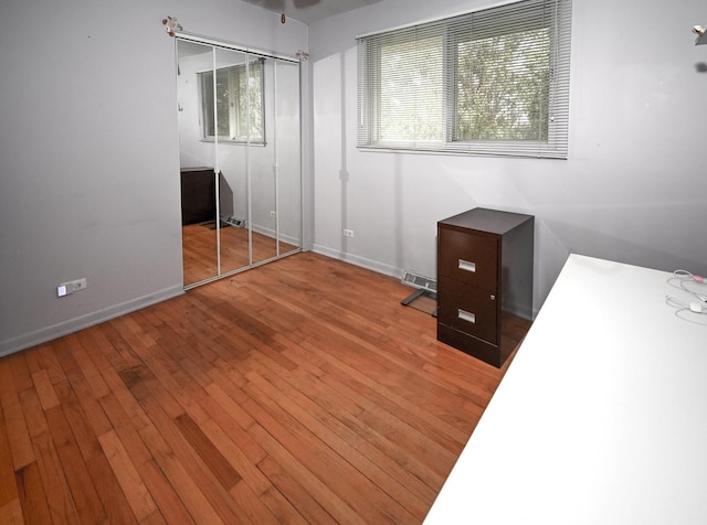 926 E Balsam Ln, Bartlett, IL 60103 - unfurnished bedroom with baseboards and hardwood / wood-style floors